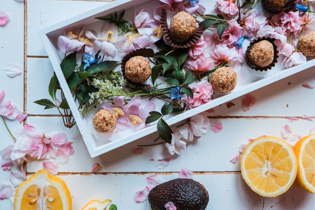 Tray of food with flowers and lemons
